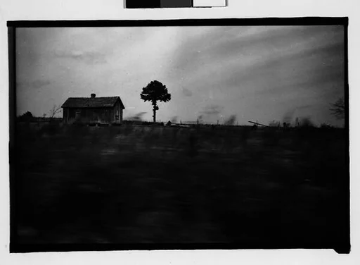 [Wooden House in Field, From Moving Automobile, Macon, Georgia]
