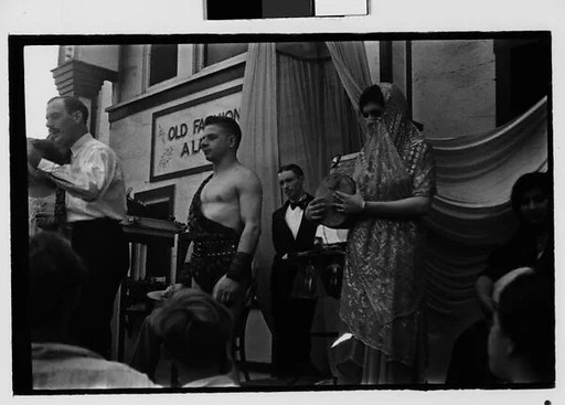 [Three 35mm Film Frames: Sideshow Barker, Strongman, and Indian Musicians, Coney Island, New York]