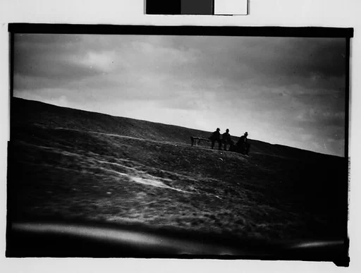 [People Seated on Levee Bench, From Moving Automobile, New Orleans Vicinity, Louisiana]
