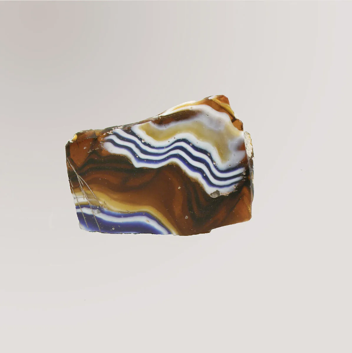 Glass mosaic ribbed bowl fragment — Unknown