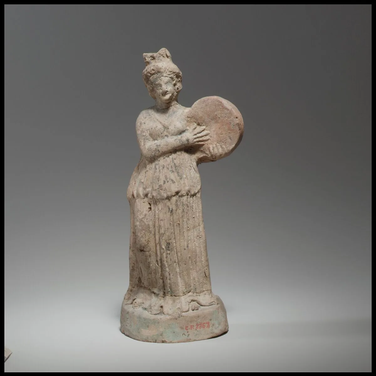 Terracotta statuette of woman playing a tympanon — Unknown