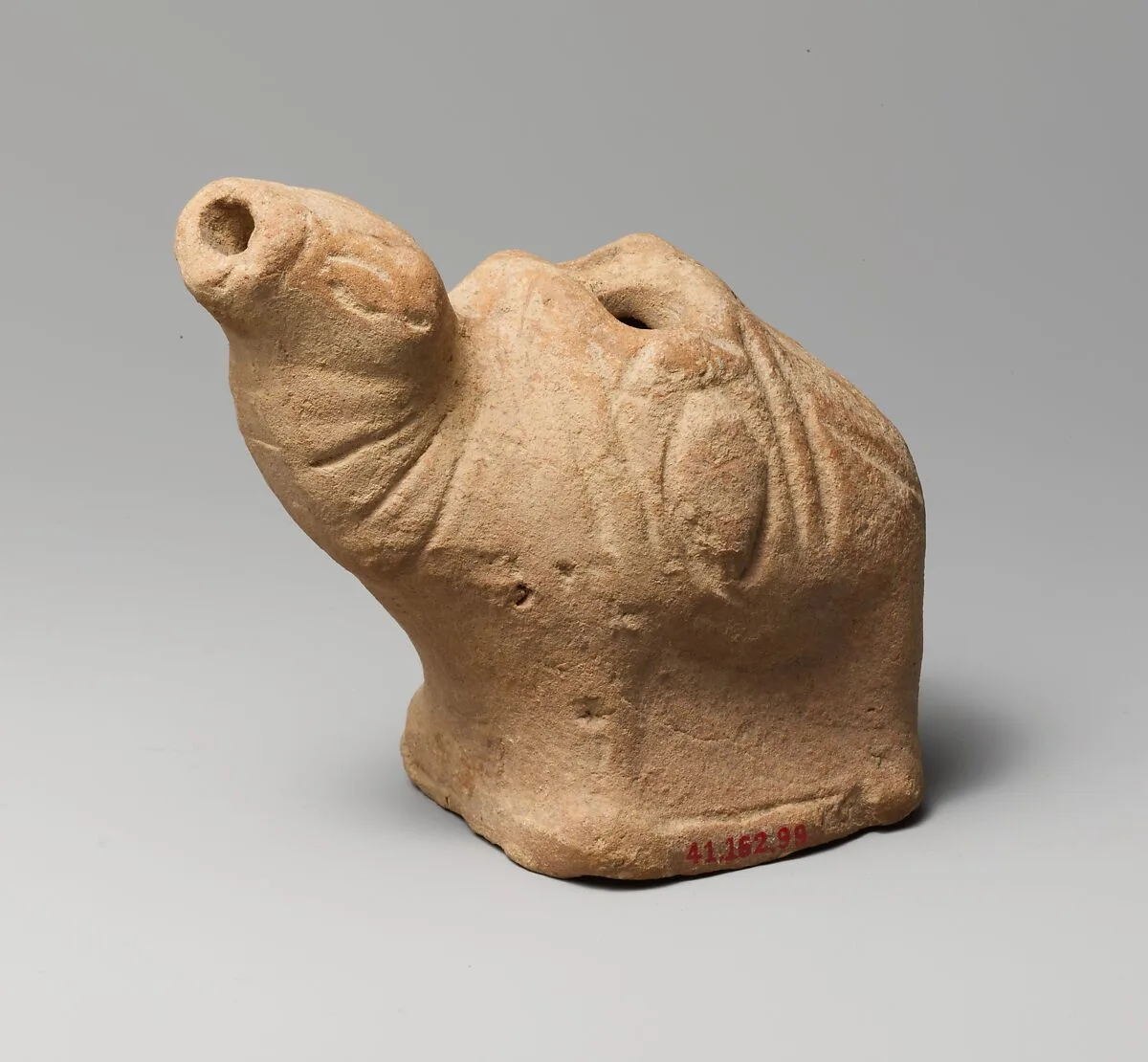 Terracotta lamp in the form of a camel — Unknown