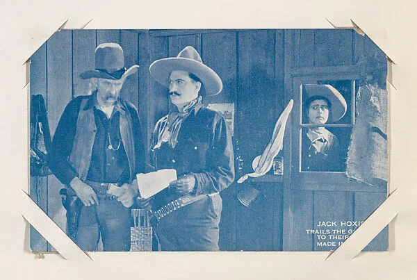 Jack Hoxie trails the gunmen to their den from Western Stars or Scenes Exhibit Cards series (W412) — Unknown