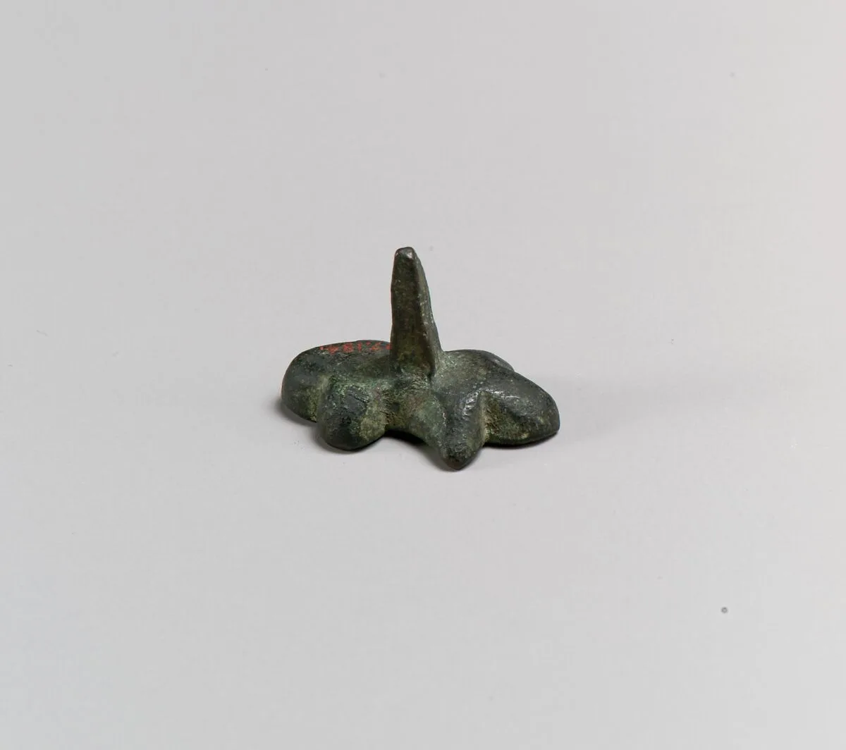 Ornament, stud or matrix for an ornament ? — Unknown