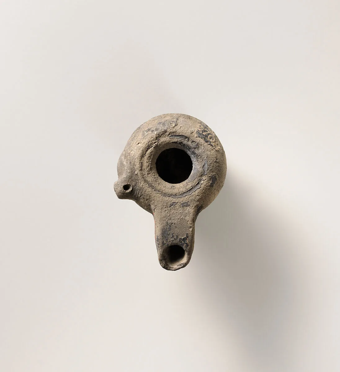 Terracotta oil lamp — Unknown