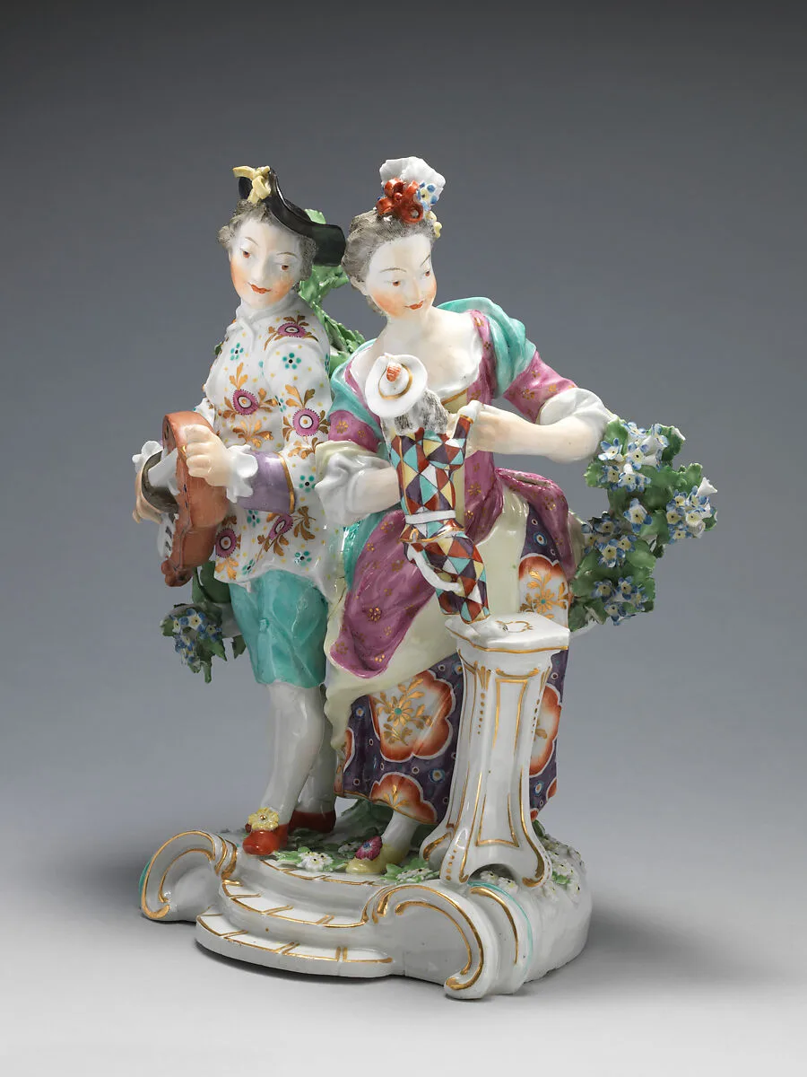 Youth playing hurdy-gurdy, girl teaching dog dressed as harlequin to dance — Derby Porcelain Manufactory