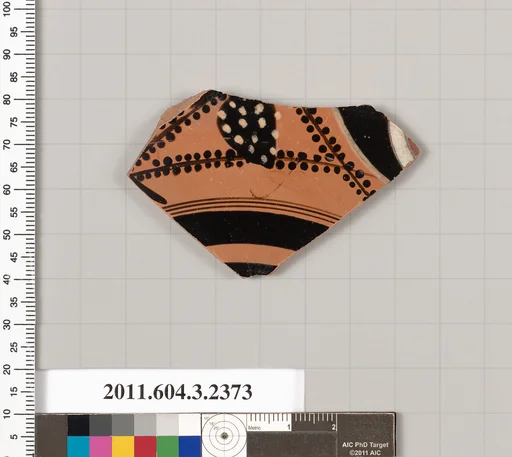 Terracotta fragment of a kylix: eye-cup (drinking cup)
