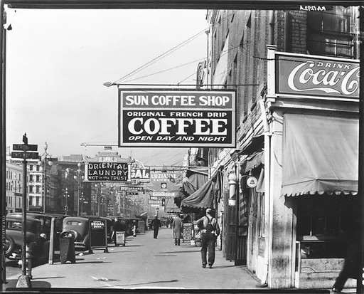 [View Down Canal Street with Coffee Shop Sign, New Orleans, Louisiana]