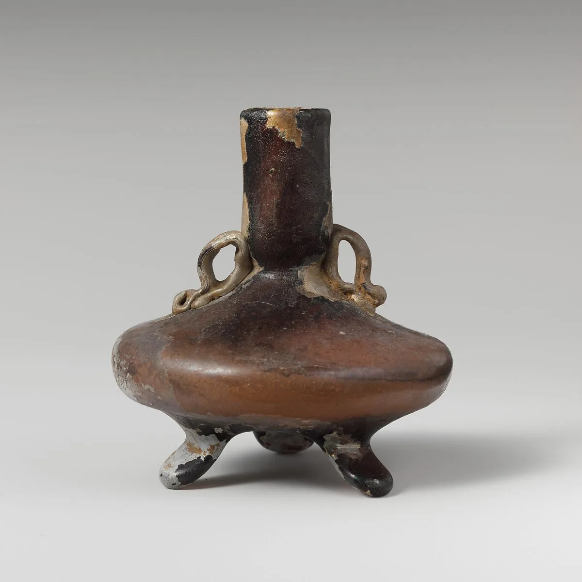 Glass bottle with three feet — Unknown