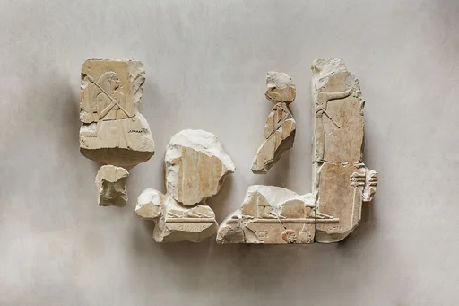 Relief fragments from the tomb of Queen Neferu: male and female attendants