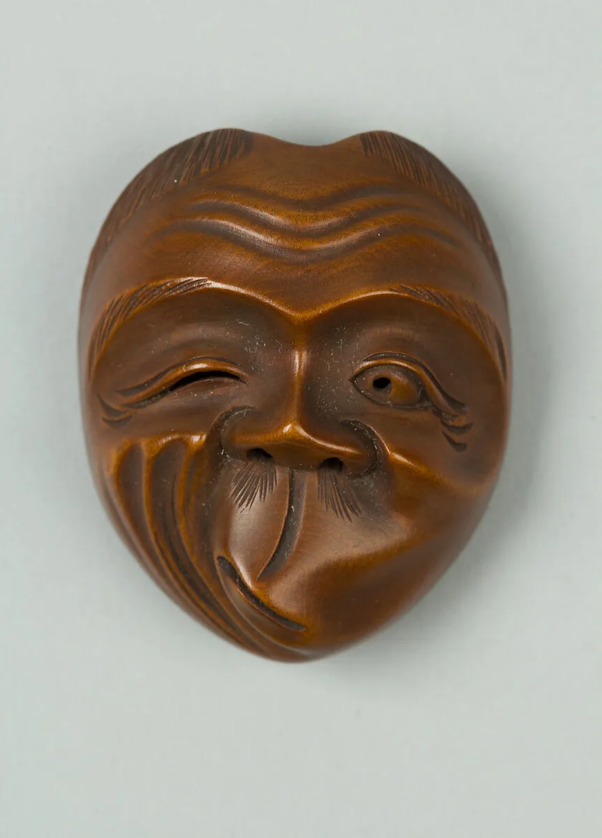 嘯吹面木彫根付 銘:斎山|Netsuke of Usofuki Mask — Unknown
