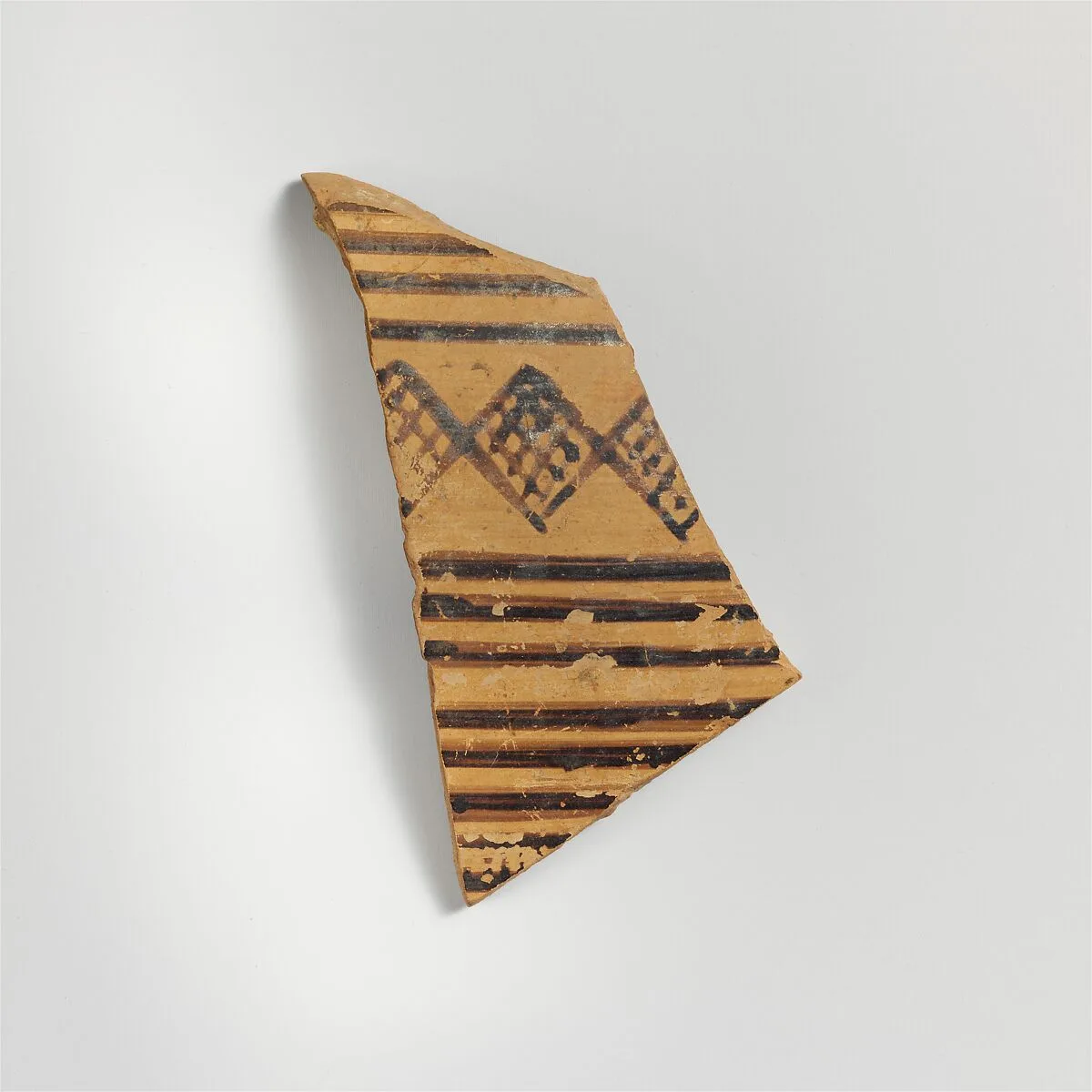 Terracotta sherd from a vessel with horizontal bands and cross-hatched diamond pattern — Unknown