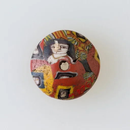 Bead with face canes