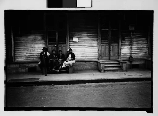 [Group Seated on Stoop in French Quarter, New Orleans, Louisiana]