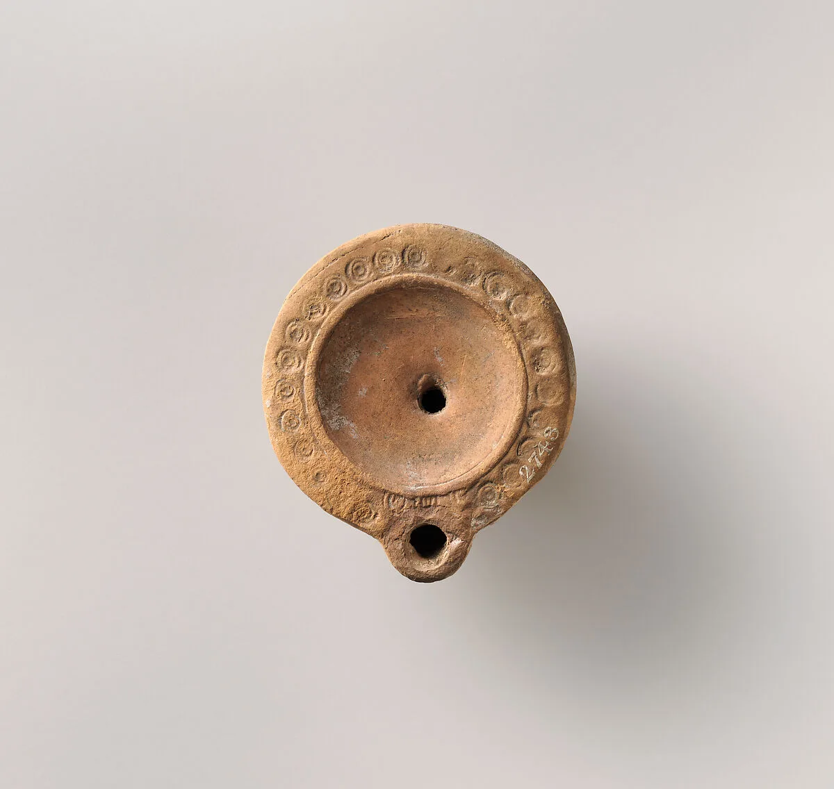 Terracotta oil lamp — Unknown