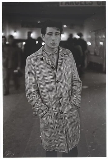 Young man in a plaid coat with a tooth pick, N.Y.C. 