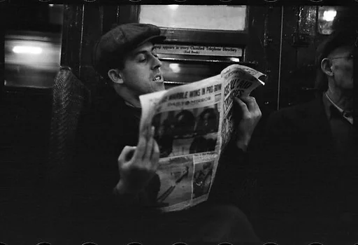 [Five 35mm Film Frames: Subway Passengers, New York City: Man in Cap Reading Newspaper, Subway Car Interior]