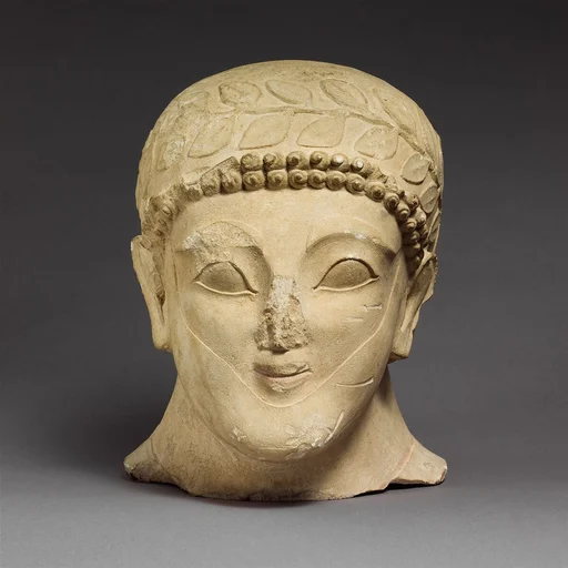 Head of a bearded male with a wreath of leaves
