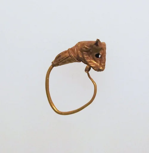 Gold earring with head of a bull
