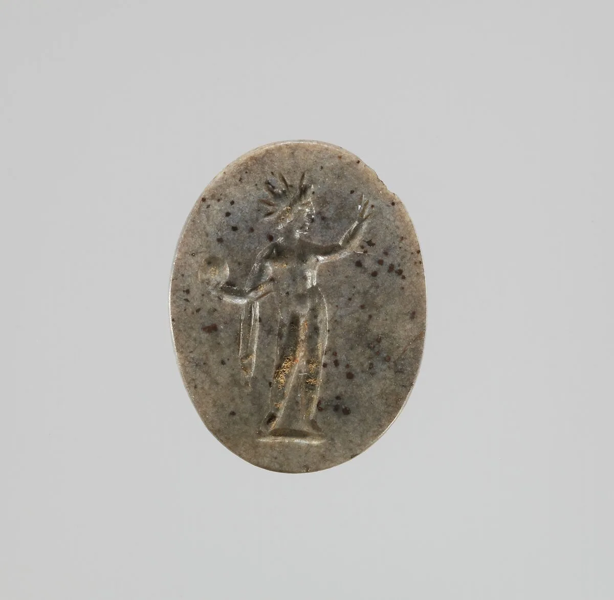 Hematite intaglio: Standing deity — Unknown