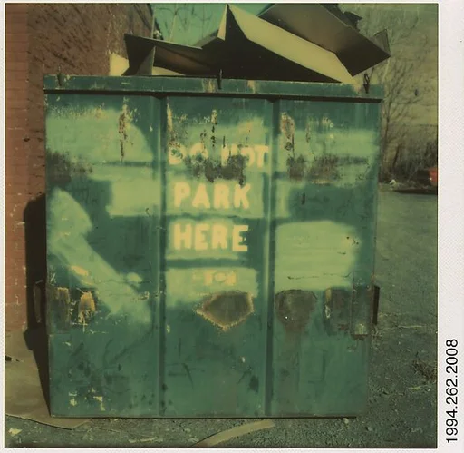 [Dumpster Marked "DO NOT PARK HERE"]