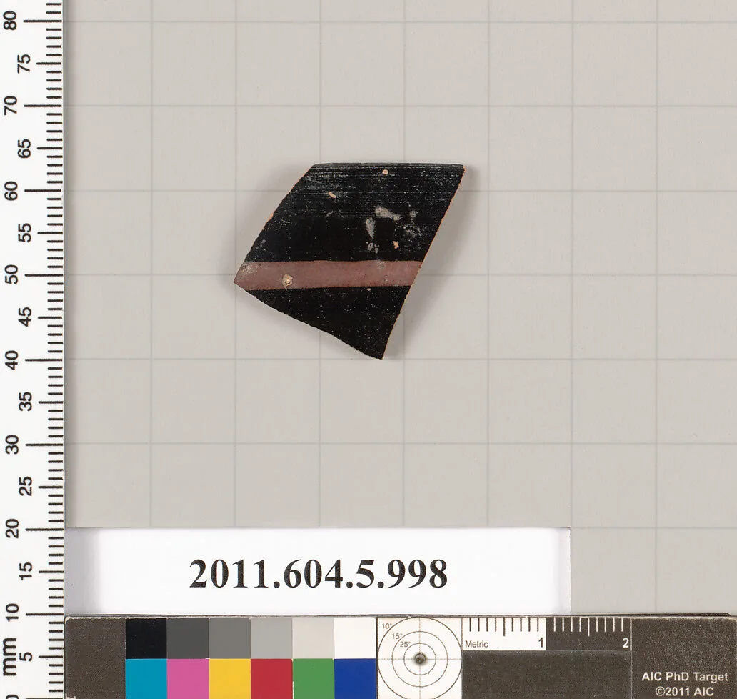 Terracotta rim fragment of a kylix (drinking cup)? — Unknown