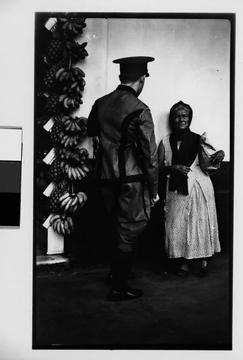 [Policeman Speaking to Fruit Vendor on Street, Havana]