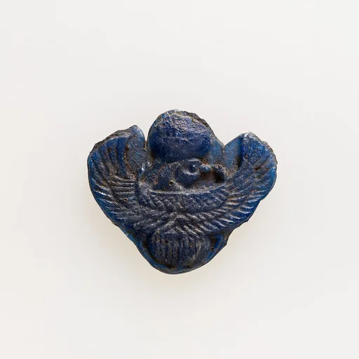 Amulet of winged scarab with falcon head