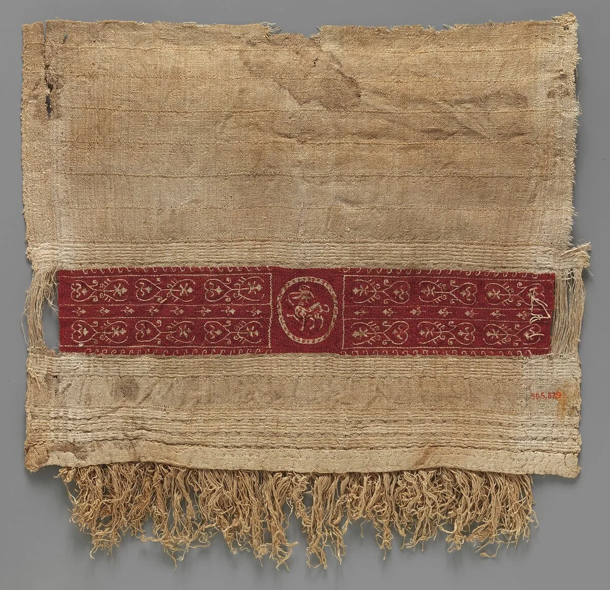 Sleeve Fragment with a Band Decorated with an Animal — Unknown