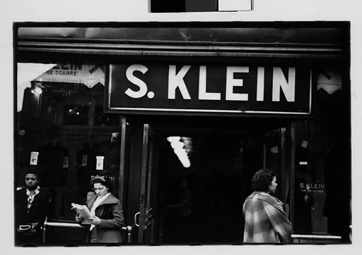 [Five 35mm Film Frames: Shoppers Outside Klein's Department Store Entrance, Sidewalk Vendor and Shoppers Beneath Billboard, Union Square, New York City]