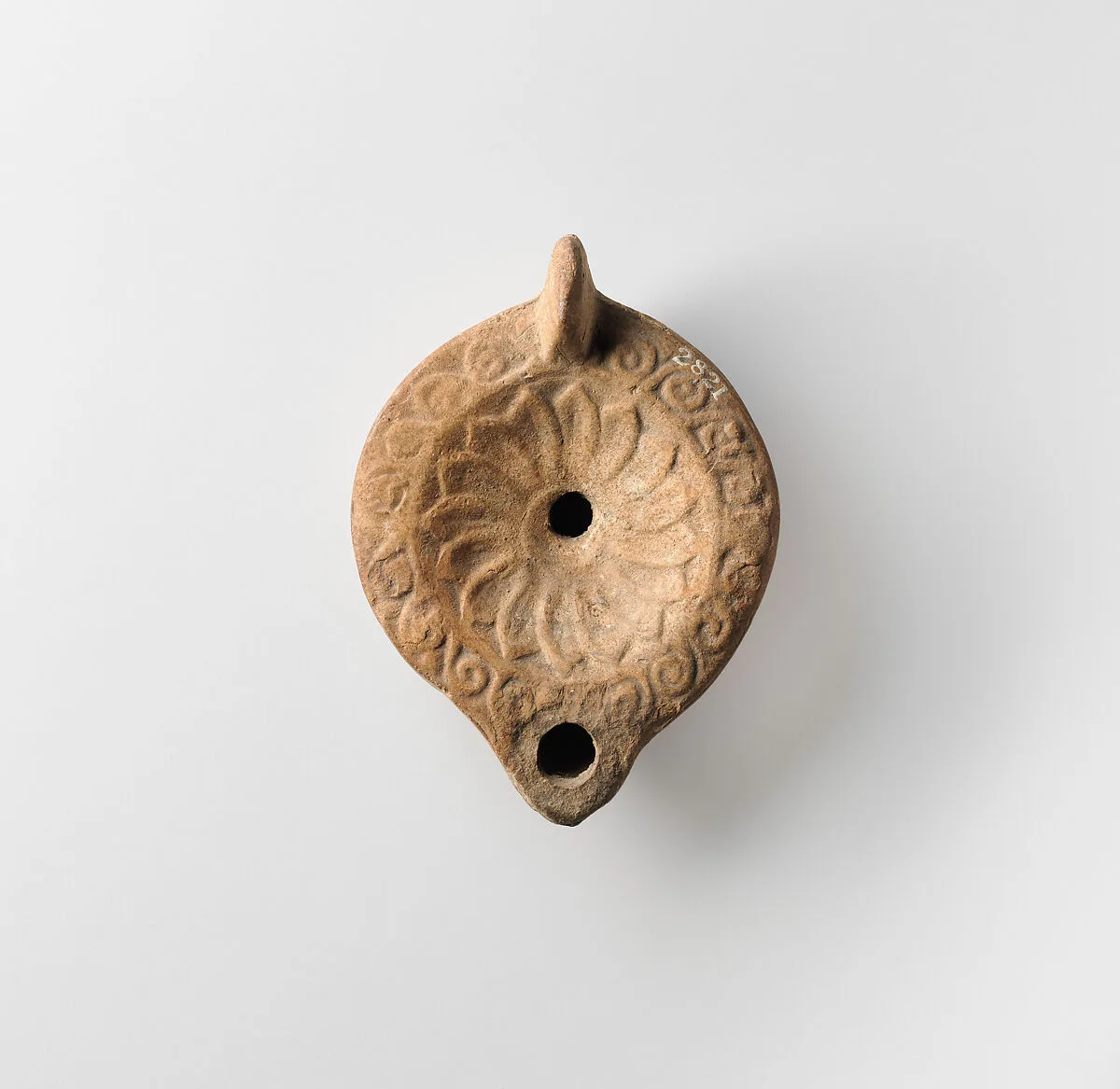 Terracotta oil lamp — Unknown