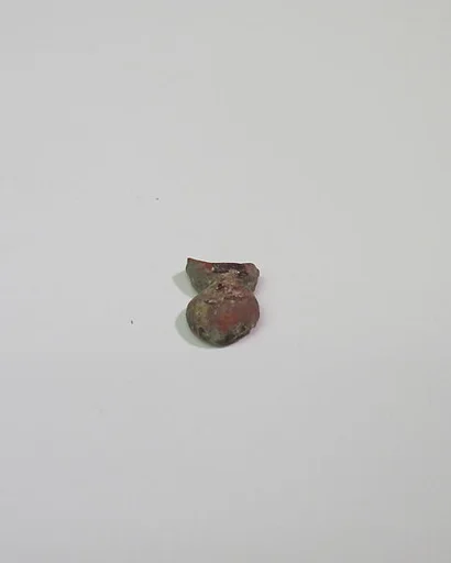 Mold-pressed amulet or fragment