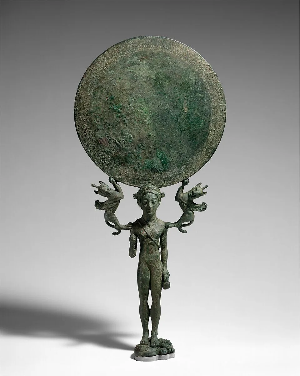 Bronze mirror with a support in the form of a nude girl — Unknown
