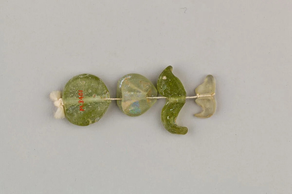 String of 4 beads — Unknown