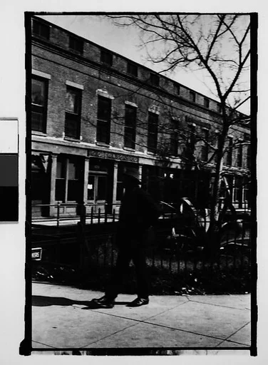 [Pedestrian in Front of Waterfront Warehouse Buildings, Savannah, Georgia]