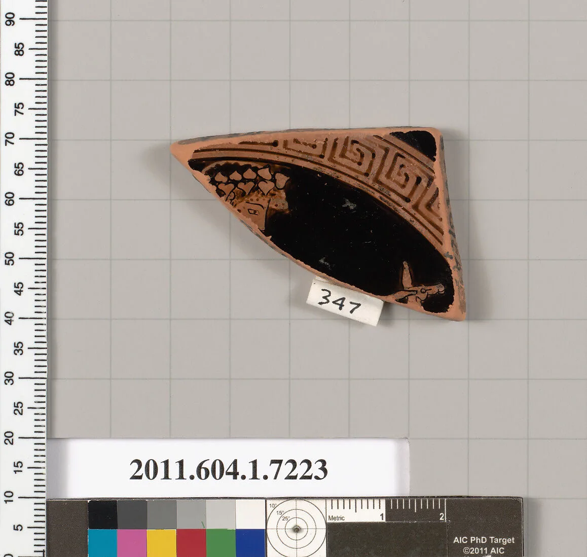Terracotta fragment of a kylix (drinking cup) — Makron