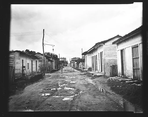 [View Down Dirt Road with Wooden Houses, Havana Outskirts, Cuba]