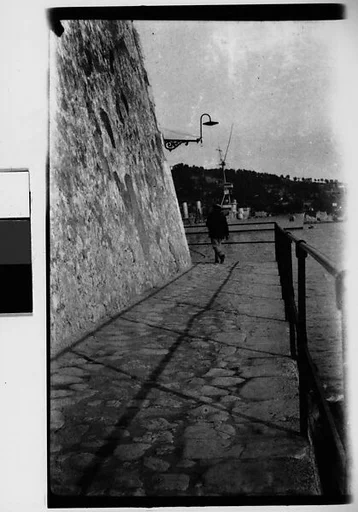 [Pedestrian on Ramparts, Coastal Town, France]