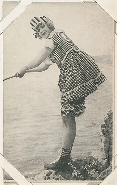 Bathing beauty in checkered costume, fishing from Mack Sennett Comedies Arcade series (W423) — Unknown