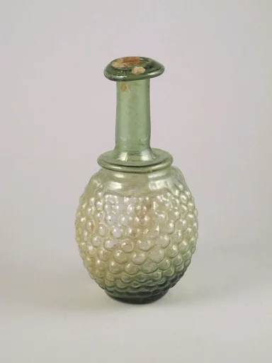 Glass bottle in the shape of a bunch of grapes