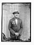 Self-portrait in bow tie and hat — Alex Agbaglo Acolatse