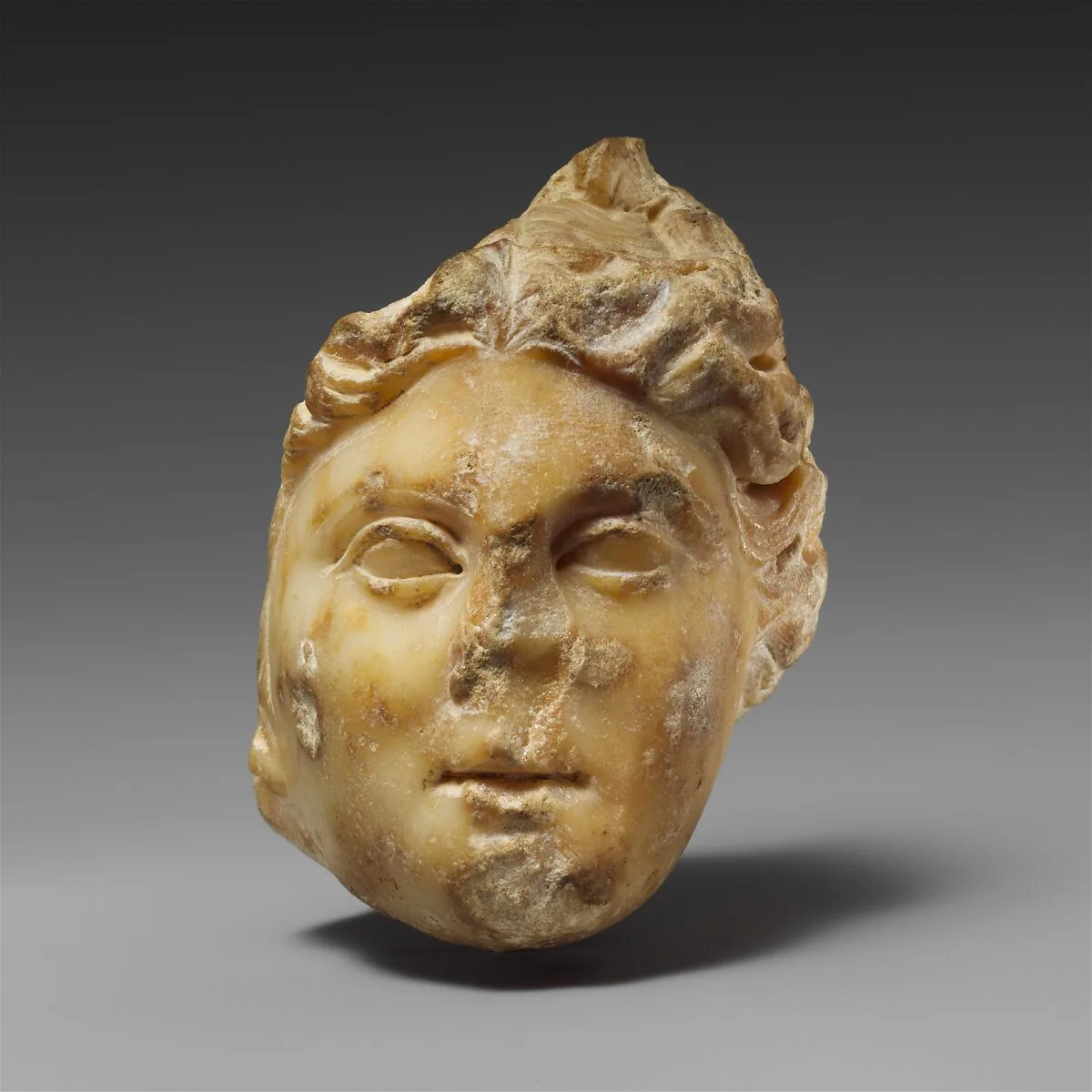Marble female relief head — Unknown