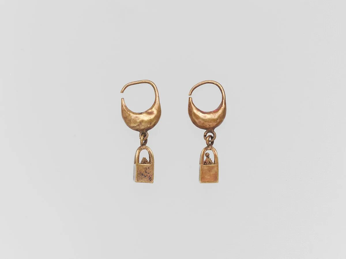 Gold earring with cage and ball pendant — Unknown