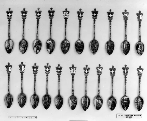Souvenir spoon with view of a lakeside town and castle and arms of Switzerland