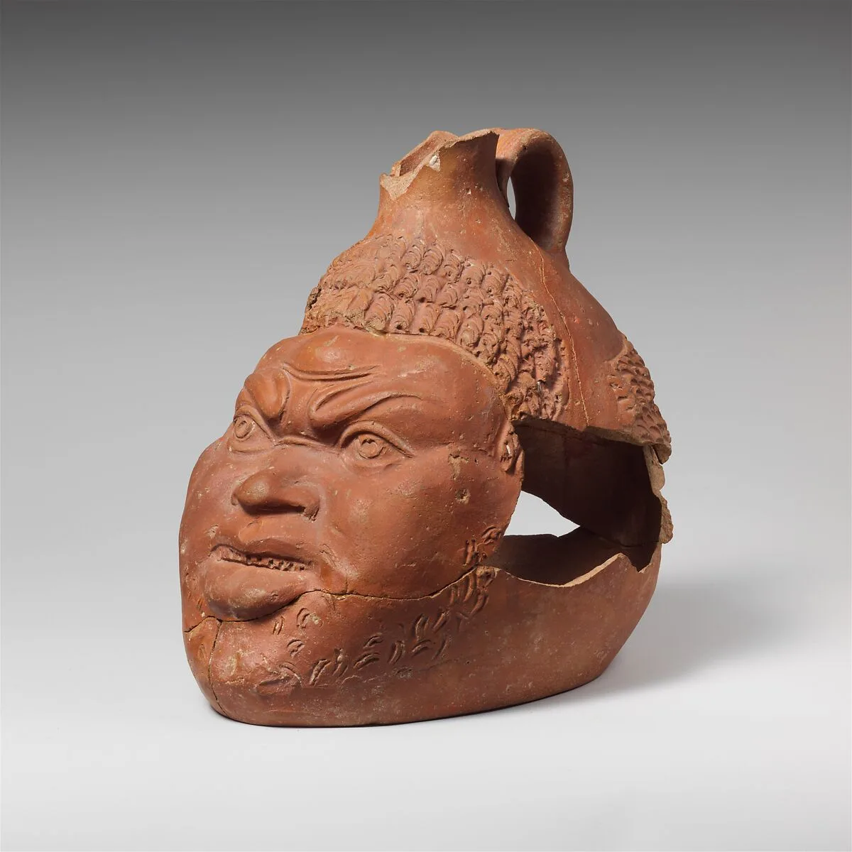Terracotta jug in the shape of a head of a Black African — Unknown