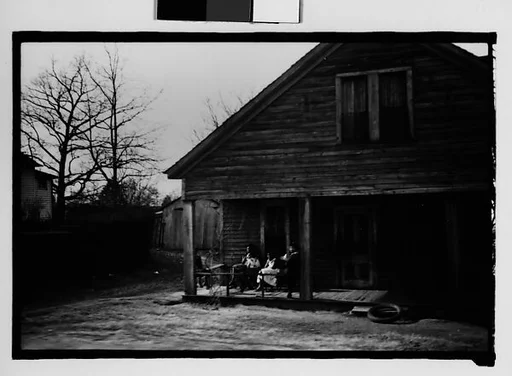 [Wooden House with Women Seated on Porch, From Car, Mobile, Alabama]