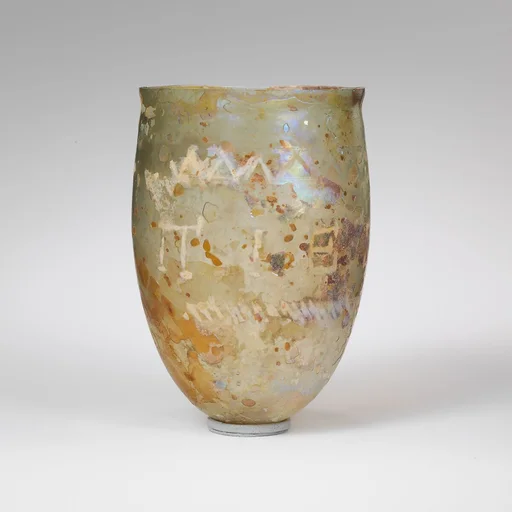 Glass beaker with cut inscription