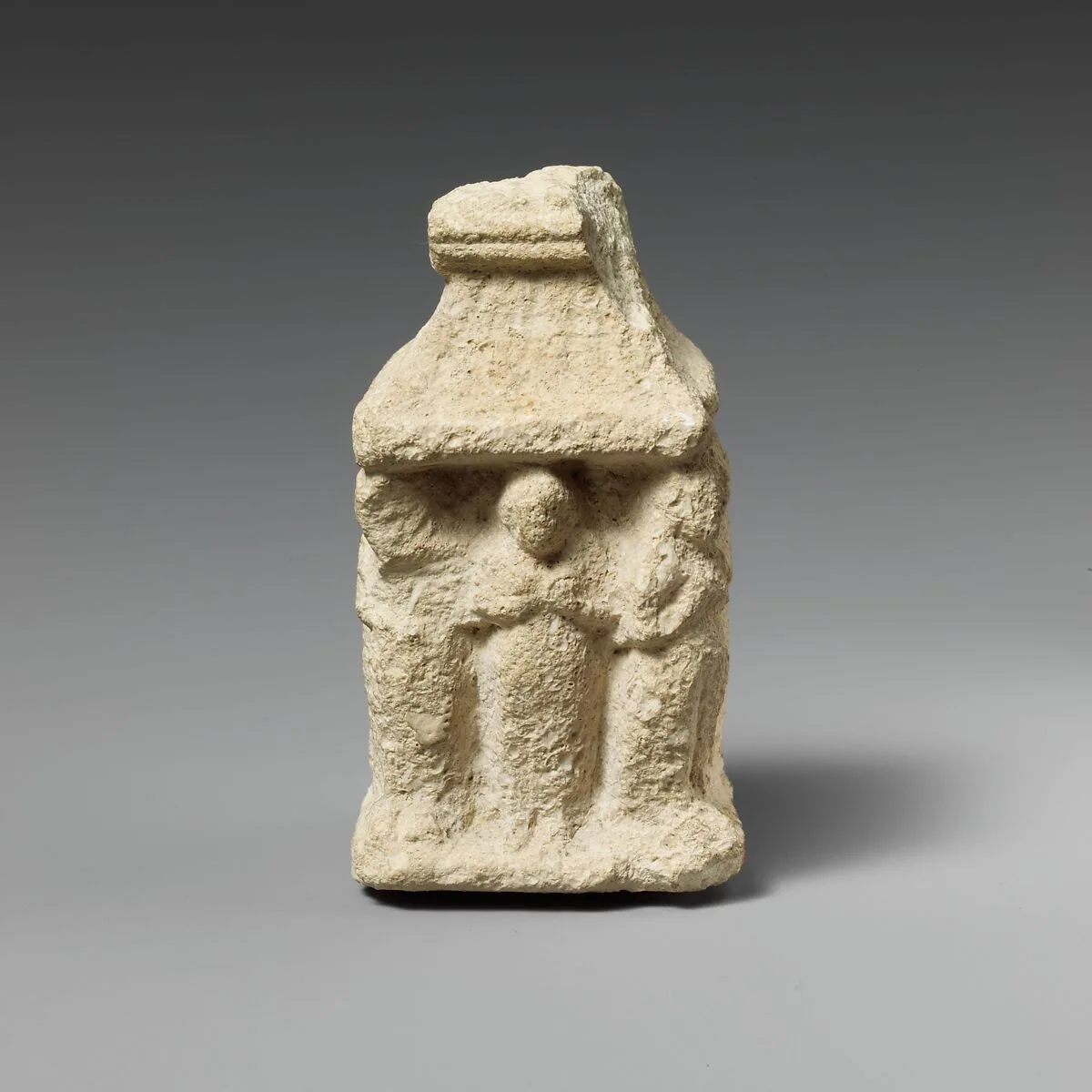 Limestone naiskos with female figures holding their breasts — Unknown
