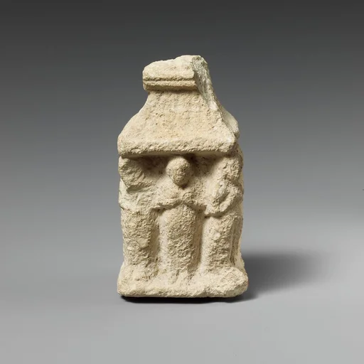 Limestone naiskos with female figures holding their breasts