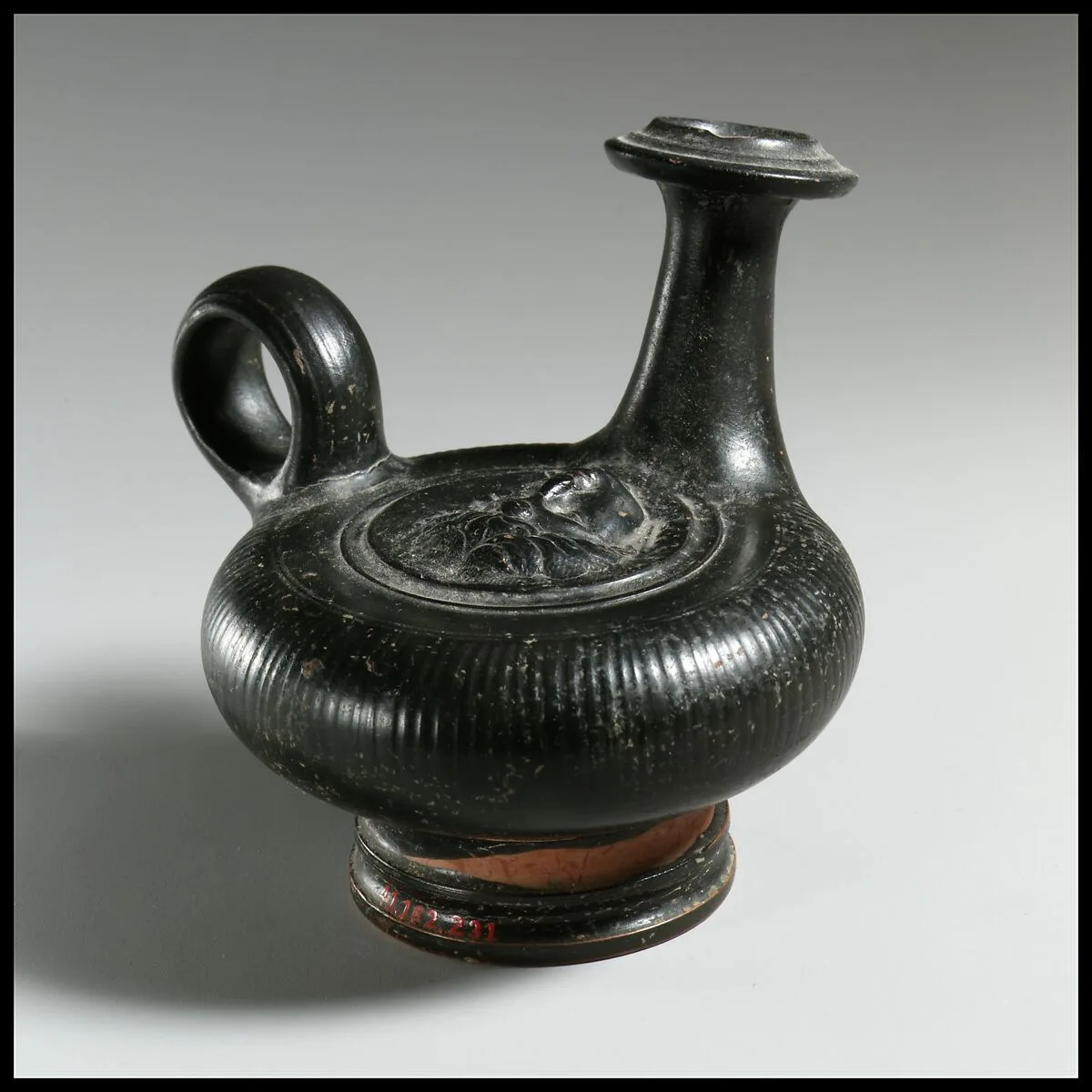 Terracotta guttus (flask with handle and vertical spout) — Unknown